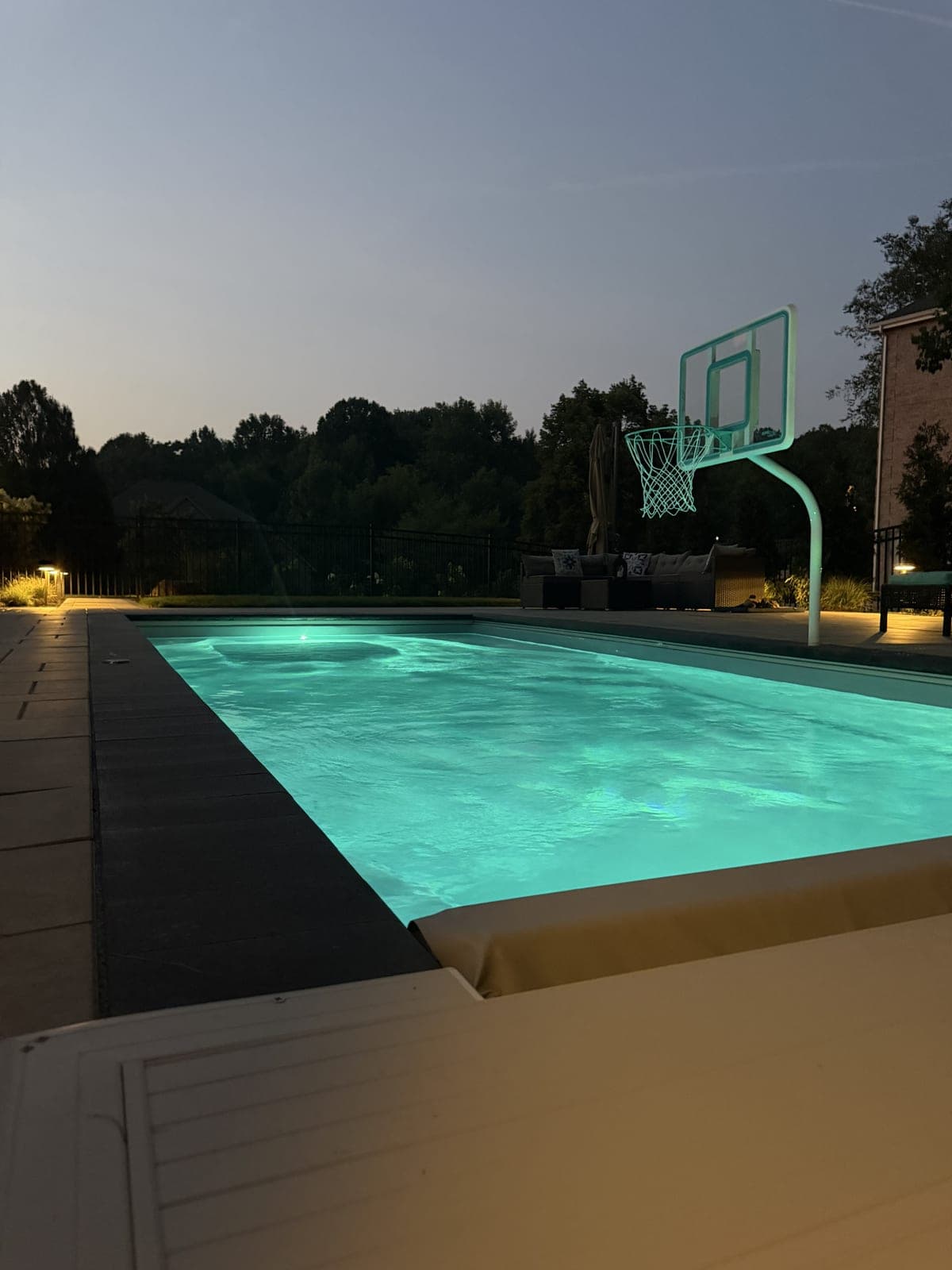 Pool glowing turquoise at night