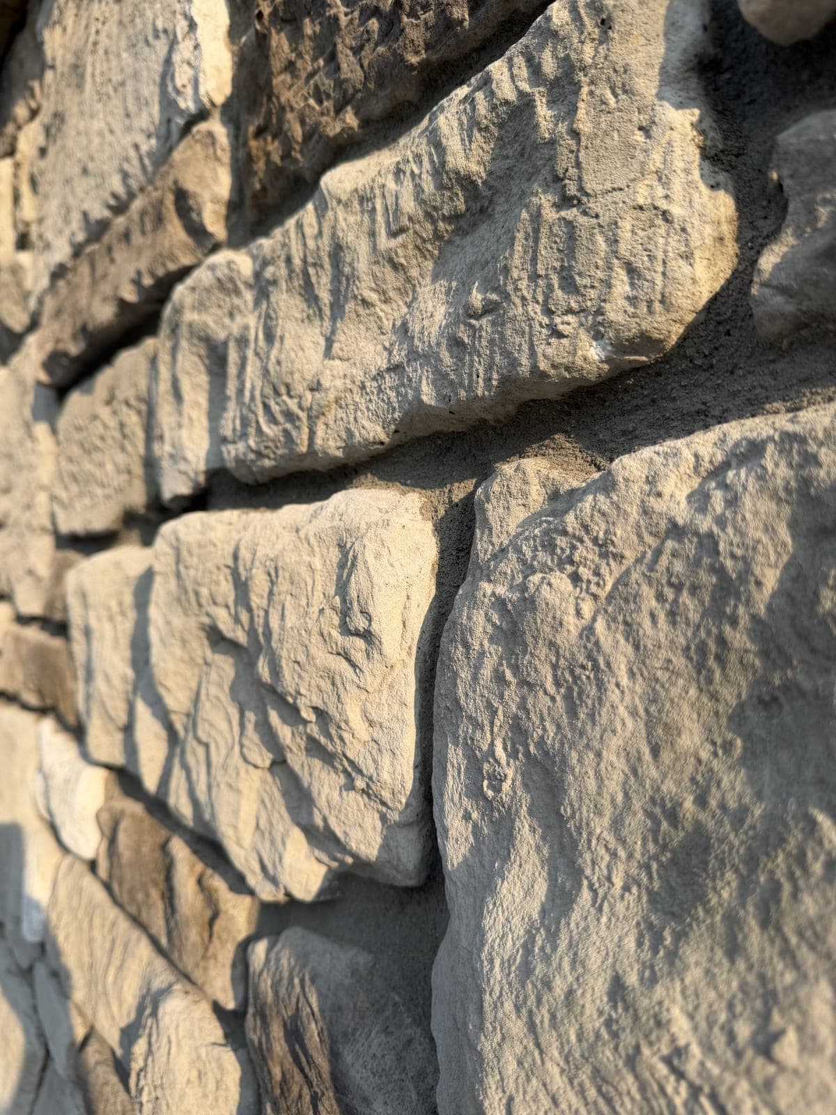 Dry-stacked natural stone retaining wall texture